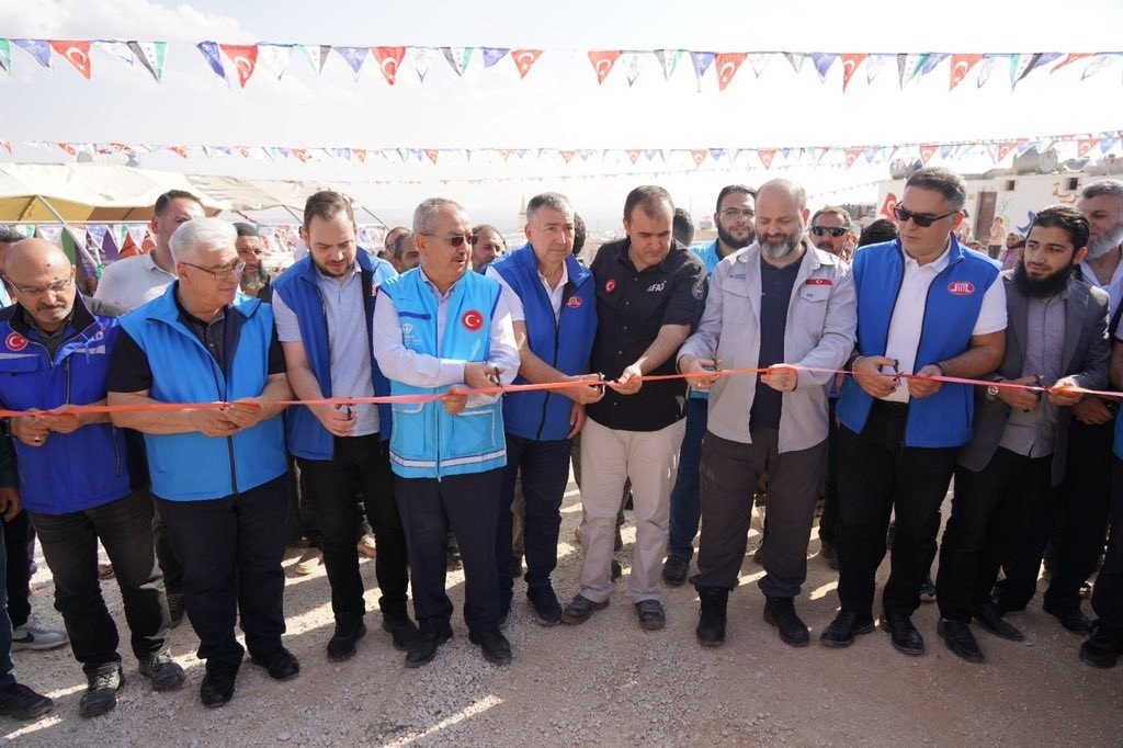 Turkish-Islamic Union of Religious Affairs (DITIB) and Türkiye Diyanet Foundation (TDV) members attend the opening ceremony for the "Kindness Homes" in Idlib, Syria, Oct. 24, 2022. (IHA Photo)