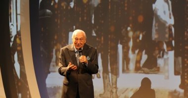 Journalist Halit Kıvanç speaks at an unidentified event in this undated file photo. (IHA File Photo)