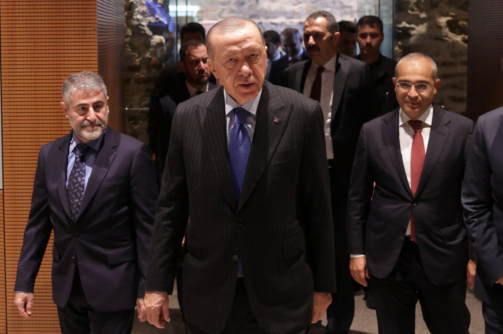 President Recep Tayyip Erdoğan, accompanied by Treasury and Finance Minister Nureddin Nebati (L), arrives at a meeting in Istanbul, Türkiye, Oct. 3, 2022. (Reuters Photo)