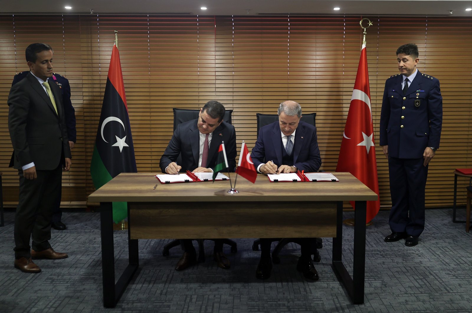Libyan Prime Minister Abdul Hamid Dbeibah (L) and Turkish Defense Minister Hulusi Akar during a signing ceremony in Istanbul, Türkiye, Oct. 25, 2022. (AA Photo)