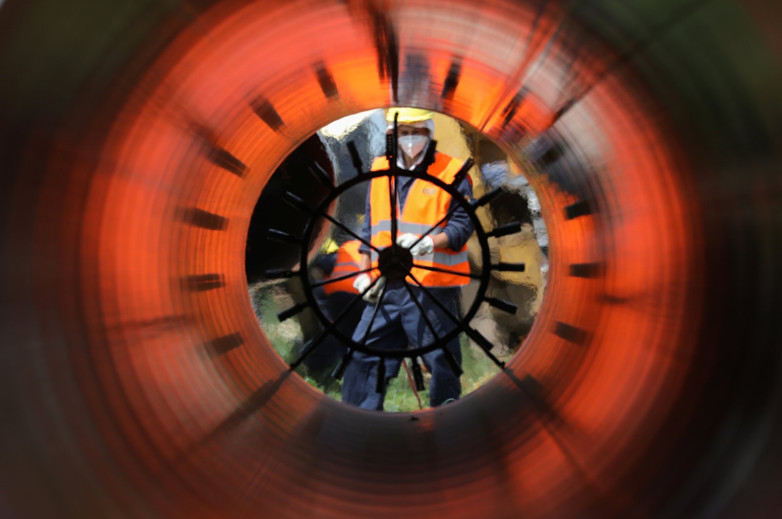 Workers are seen through a pipe at a construction site on the extension of the TurkStream gas pipeline in Letnitsa, Bulgaria, June 1, 2020. (Reuters Photo)
