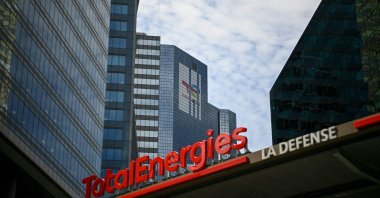 The TotalEnergies logo is seen during its unveling ceremony, at a charging station in La Defense on the outskirts of Paris, France, May 28, 2021. (AFP Photo)