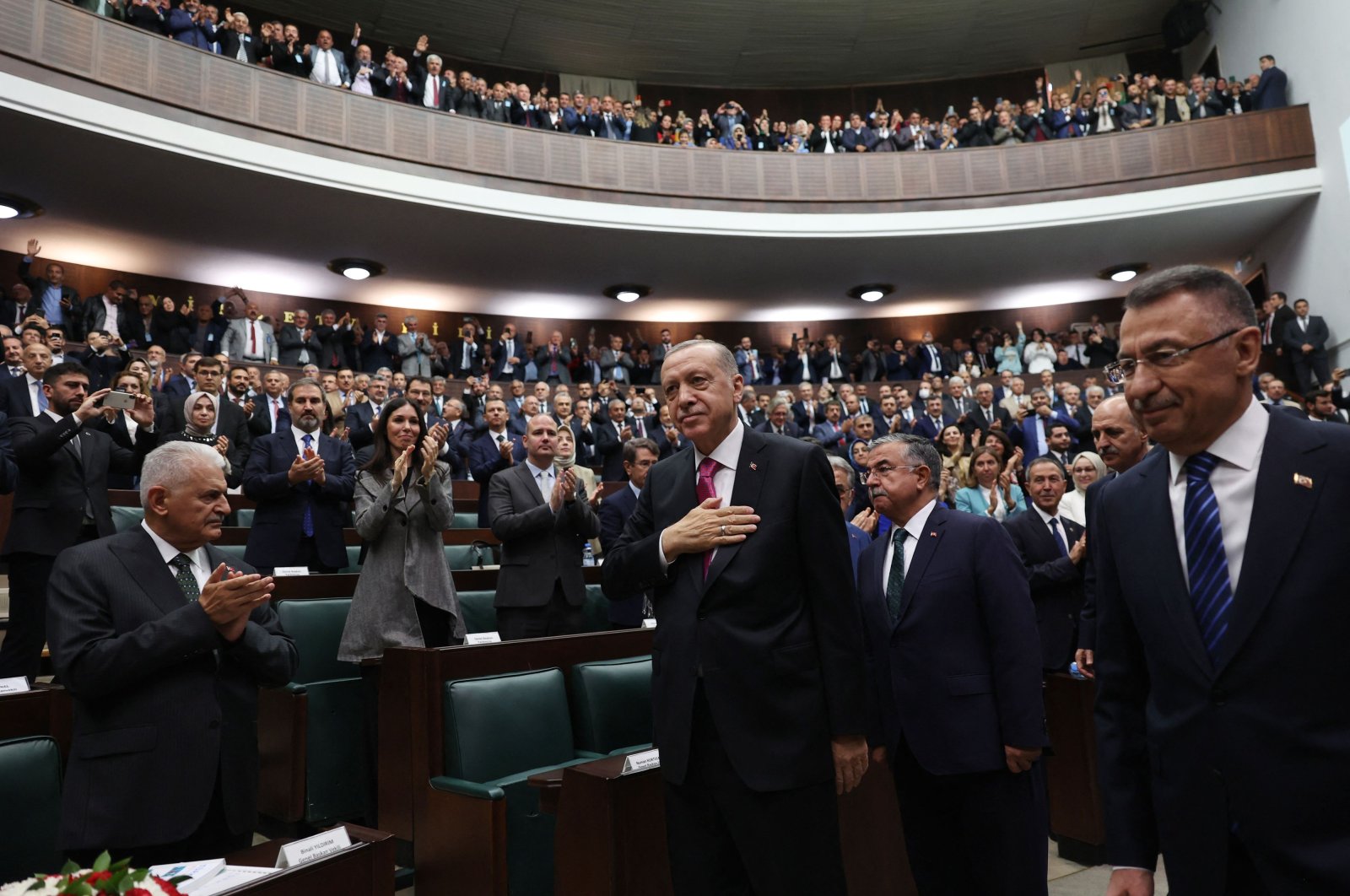 President Recep Tayyip Erdoğan (C) greets lawmakers during his ruling Justice and Development Party&#039;s (AK Party) group meeting at the Turkish Parliament, in the capital Ankara, Türkiye, Oct. 19, 2022. (AFP Photo)