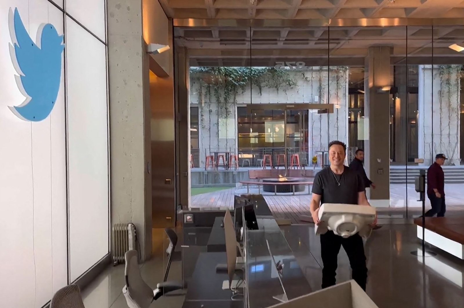 This screenshot from a video posted on Twitter by Elon Musk shows himself carrying a sink to the Twitter HQ, San Francisco, U.S., Oct. 26, 2022. (AFP Photo)
