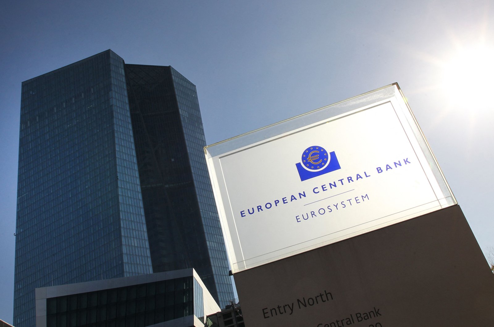 The logo and the headquarters of the European Central Bank (ECB) are pictured ahead of a press conference on the eurozone monetary policy in Frankfurt am Main, western Germany, Oct. 27, 2022. (AFP Photo)