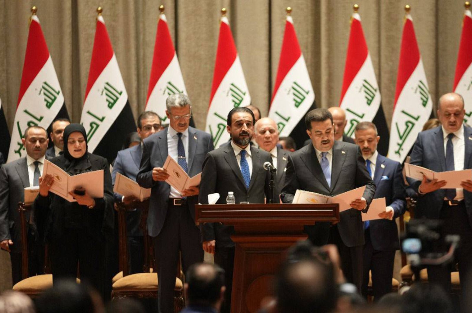 A handout picture released by the Iraqi parliament media office shows Members of the new cabinet taking the constitutional oath during the Iraqi parliament session in Baghdad, Iraq on 27 October 2022. (EPA Photo)