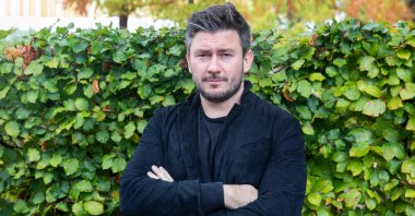 Dissident Russian author Dmitry Glukhovsky poses for a photograph at the 23rd Frankfurt Book Fair at the Messe in Frankfurt am Main, western Germany, Oct. 21, 2022. (AFP Photo)