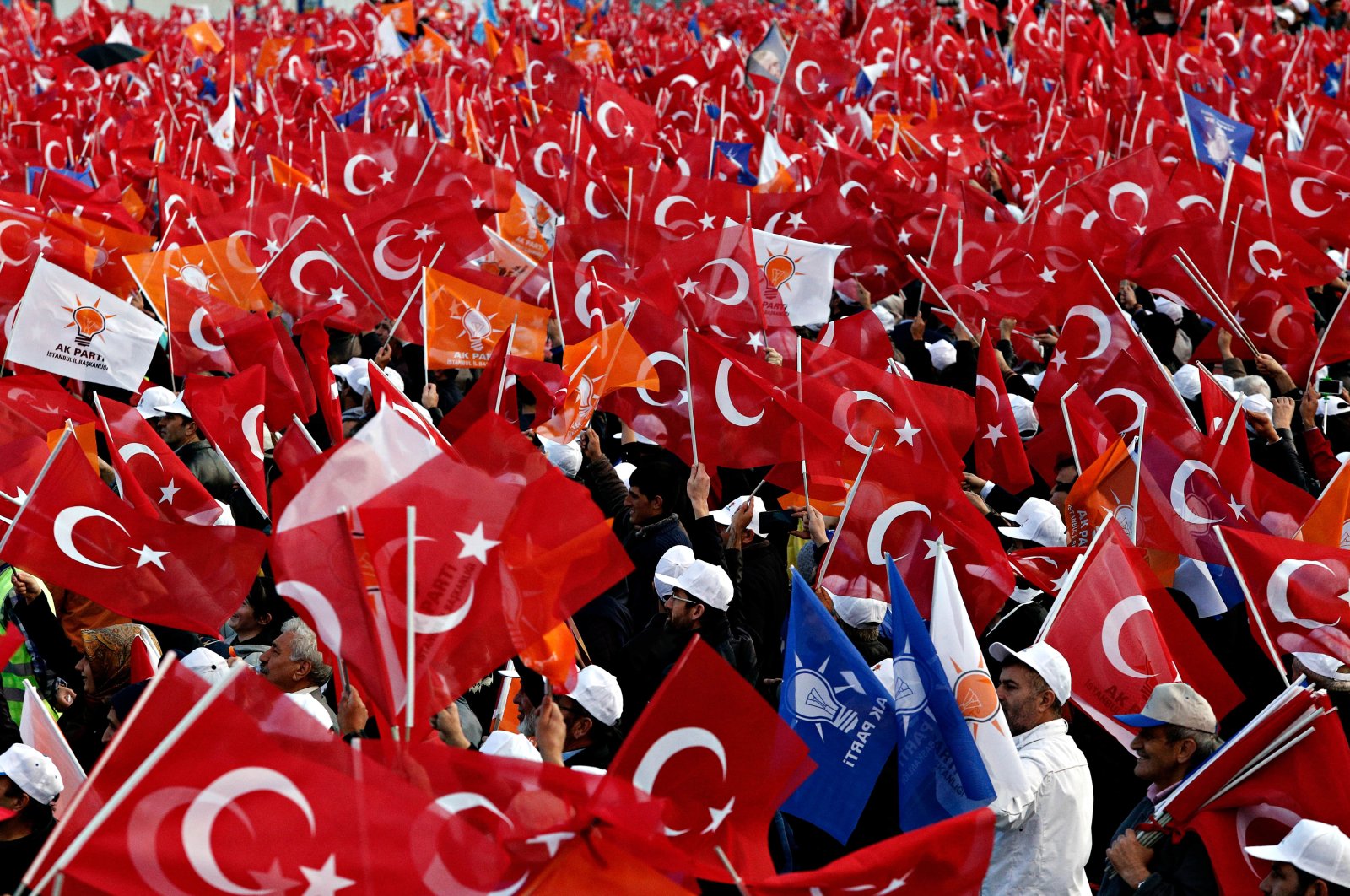 Turkish people during a meeting of the ruling Justice and Development Party&#039;s (AK Party) are seen in this undated photo, Türkiye. (Shutterstock Photo)