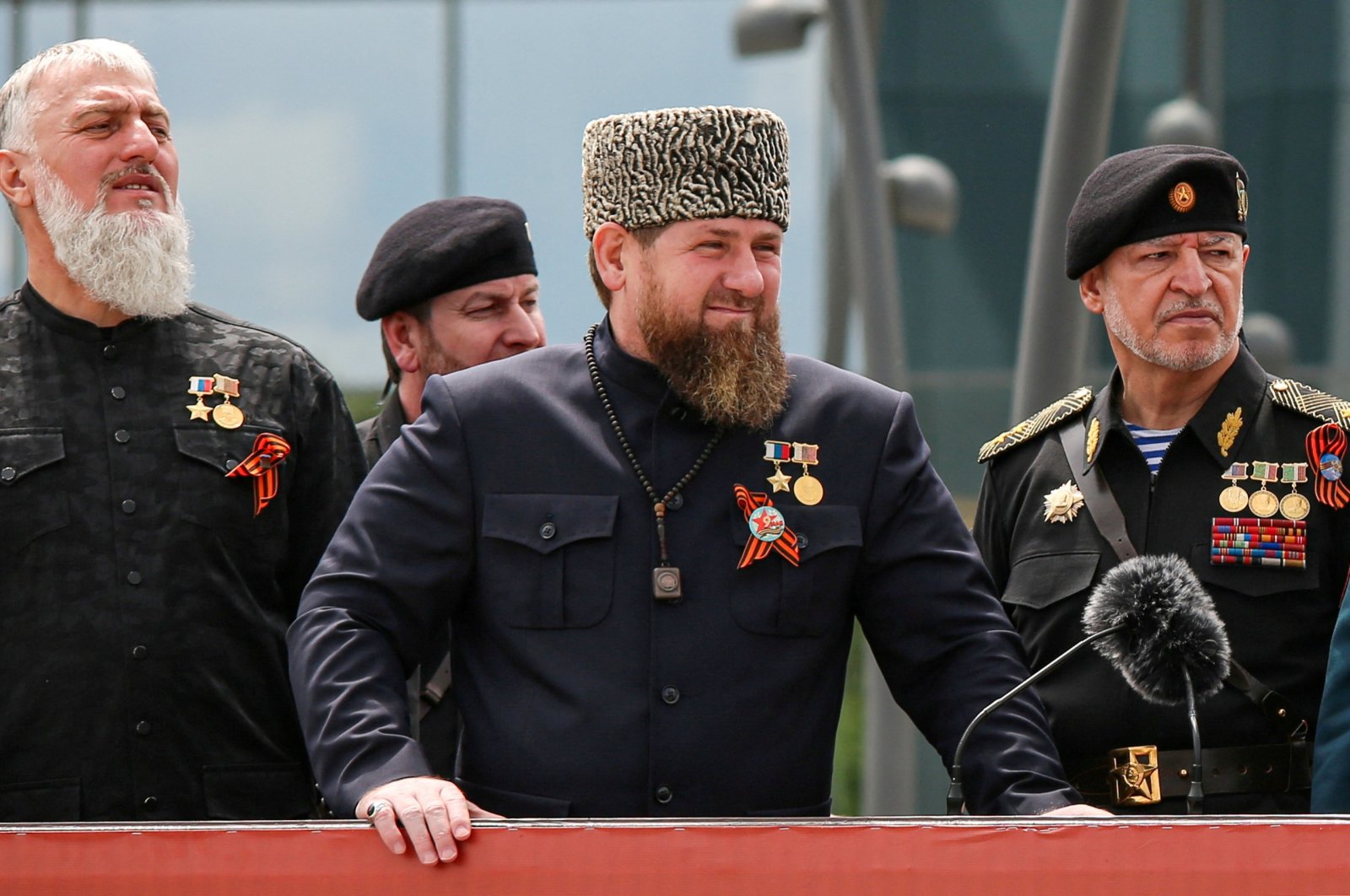 Head of the Chechen Republic Ramzan Kadyrov (С), Interior Minister Ruslan Alkhanov (R) and Russia&#039;s State Duma member Adam Delimkhanov attend a military parade on Victory Day, which marks the 77th anniversary of the victory over Nazi Germany in World War II, Grozny, Russia, May 9, 2022. (Reuters Photo)