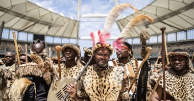 Amabutho, Zulu King regiments, clad in traditional dress and carrying shields and sticks, are seen at the Moses Mabhida Stadium in Durban, South Africa, Oct. 29, 2022. (AFP Photo)