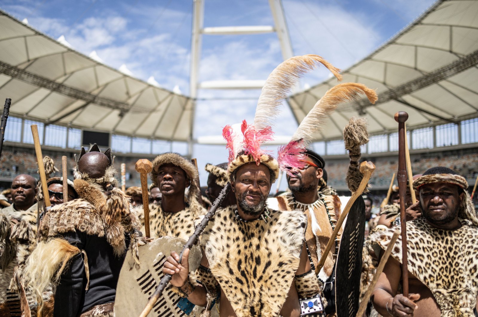 Amabutho, Zulu King regiments, clad in traditional dress and carrying shields and sticks, are seen at the Moses Mabhida Stadium in Durban, South Africa, Oct. 29, 2022. (AFP Photo)