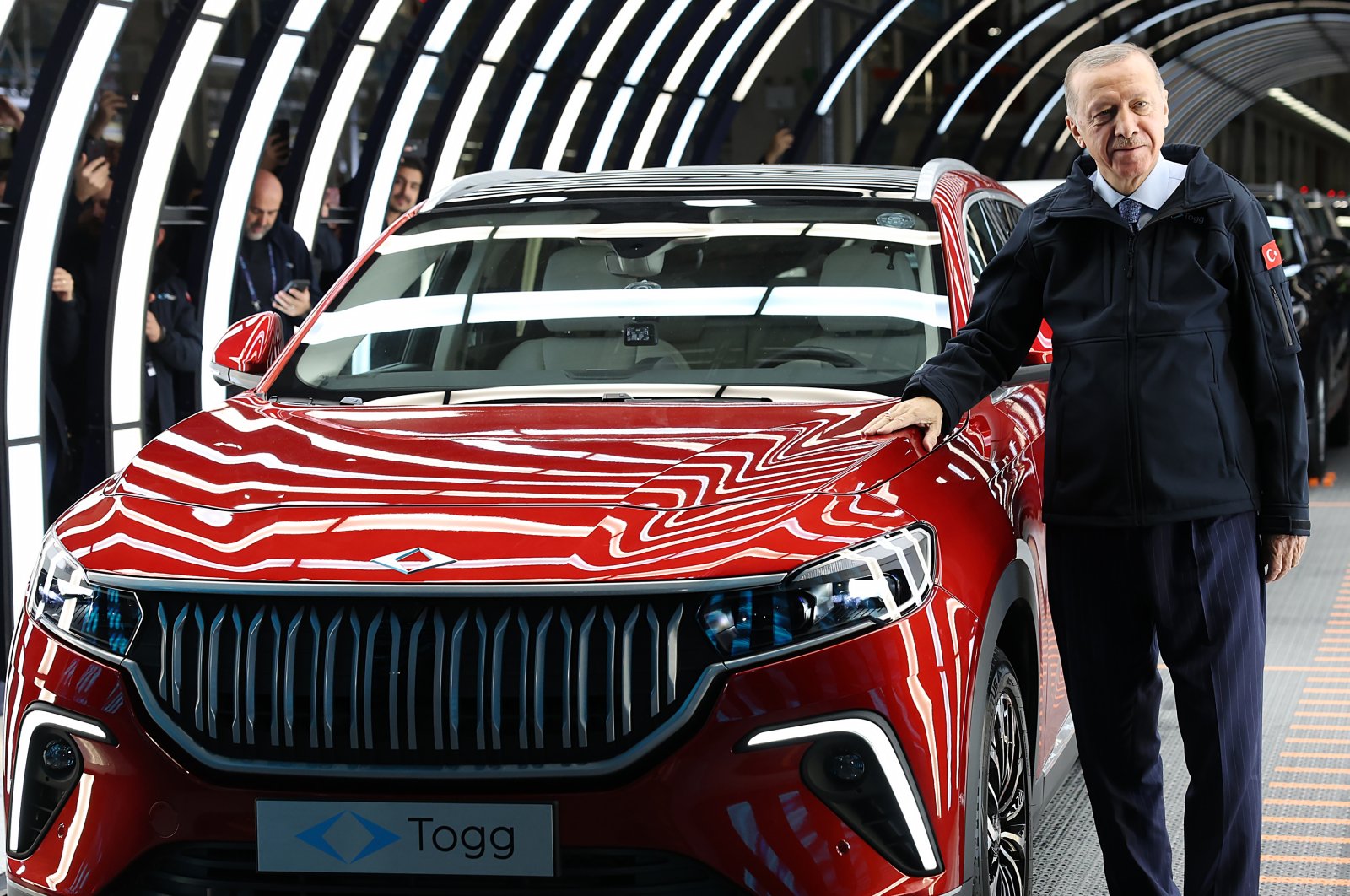 President Recep Tayyip Erdoğan poses for a photo during the inauguration of the plant for Türkiye&#039;s first automobile, in Bursa, Türkiye, Oct. 29, 2022. (AA Photo)