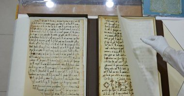 A specialist shows a fragment of the 8th century "Katta Langar" Quran, Samarkand, Uzbekistan, Oct. 21, 2022. (Reuters Photo)