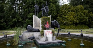 The bust of Belgium&#039;s King Leopold II is smeared with paint and graffiti on the grounds of the Royal Museum for Central Africa in Tervuren, Belgium, June 9, 2020. (AP Photo)
