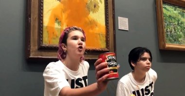 Just Stop Oil protesters in London poured tomato soup on Vincent Van Gogh&#039;s 1888 work &quot;Sunflowers&quot; at the National Gallery in London, U.K., Oct. 14, 2022. (dpa Photo)
