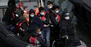 People thought to be migrants arrive to be disembarked in Dover, southeast England, June 17, 2022. (AP Photo)