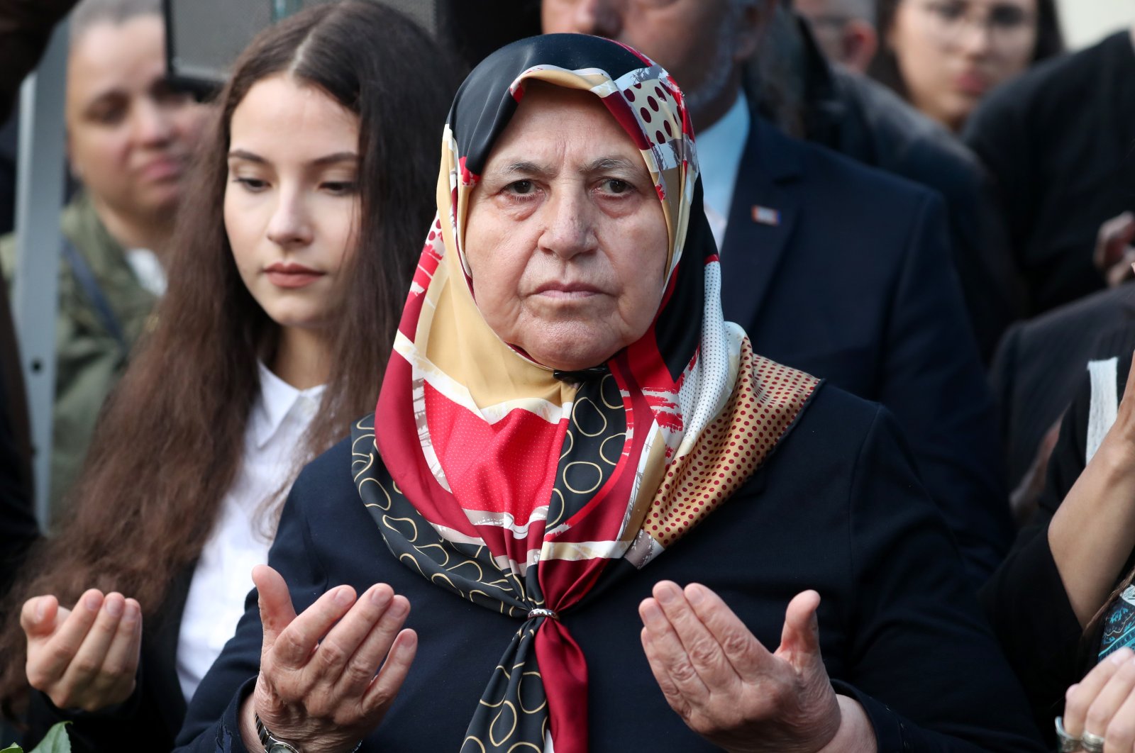 Mevlüde Genç (C), a surviving relative of the Solingen arson attack, prays during the commemoration ceremonies of the 25th anniversary of the xenophobic Solingen arson attack in Solingen, Germany, 29 May 2018.  (EPA Photo) 