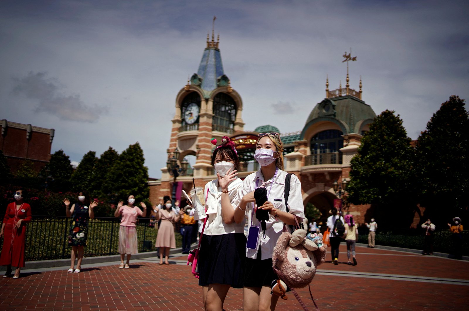 People wearing face masks visit the Shanghai Disney Resort, in Shanghai, China, June 30, 2022. (Reuters Photo)
