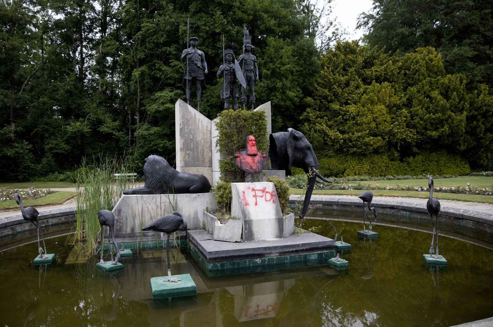 The bust of Belgium&#039;s King Leopold II is smeared with paint and graffiti on the grounds of the Royal Museum for Central Africa in Tervuren, Belgium, June 9, 2020. (AP Photo)