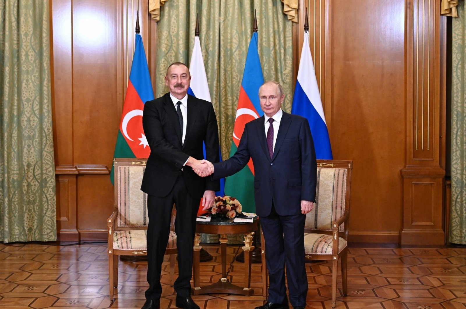 Russian President Vladimir Putin (right) and Azerbaijani President Ilham Aliyev (Left) shake hands after a meeting in Sochi, Oct. 31, 2022. (IHA Photo)