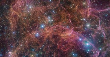 A view of the orange and pink clouds that make up what remains after the explosive death of a massive star. (Reuters Photo)