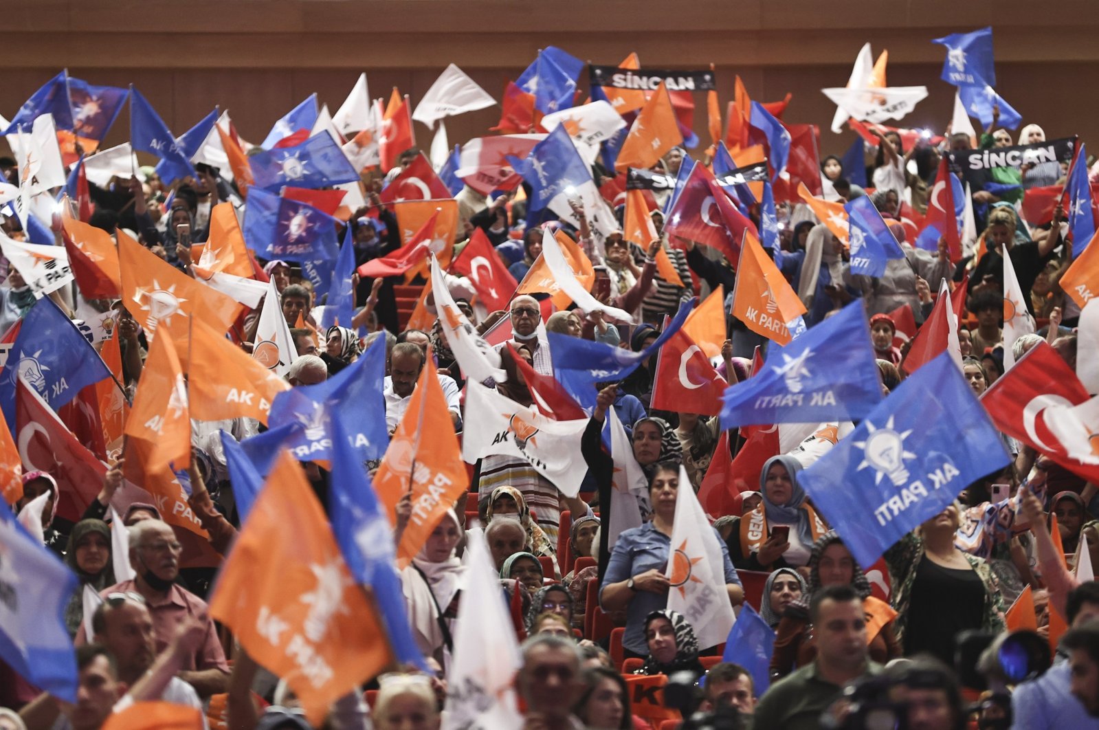 Supporters of the Justice and Development Party (AK Party) wave their flags at the AK Party&#039;s 21st founding anniversary in ATO Congresium in the capital Ankara, Türkiye, Aug. 15, 2022. (AA Photo)