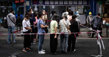 Residents wait in line during COVID-19 tests of the entire population in Macau, China, Nov. 1, 2022. (AFP Photo)