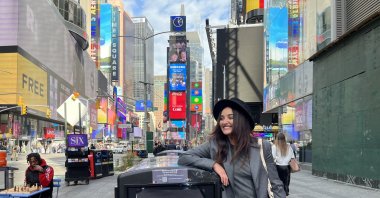Turkish actor Fadik Sevin Atasoy posing with the poster of “Muse 90401,” New York, U.S., Oct. 1, 2022. (Photo by Funda Karayel)