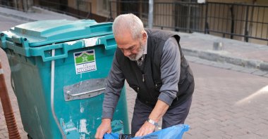 Hüseyin Ipek collects waste from the garbage to be recycled despite the opposition of his family. ( AA Photo)