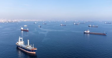 Commercial vessels including vessels that are part of the Black Sea grain deal wait to pass the Bosporus Strait off the shores of Yenikapı during a misty morning in Istanbul, Türkiye, Oct. 31, 2022. (Reuters Photo)