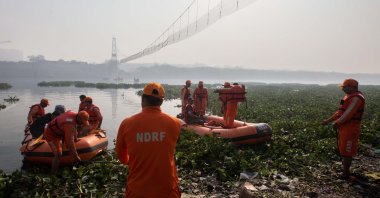An emergency rescue operation is underway following the collapse of a pedestrian suspension bridge, Morbi, India, Nov. 2, 2022. (EPA Photo)