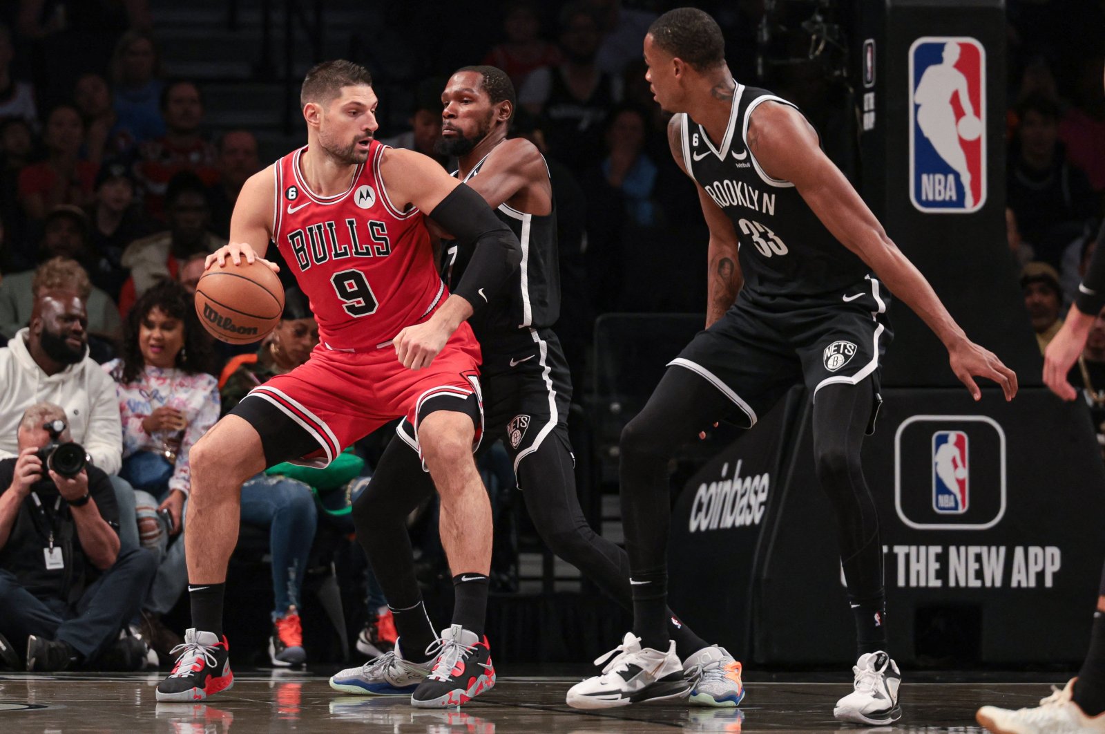 Chicago Bulls center Nikola Vucevic (9) is guarded by Brooklyn Nets forward Kevin Durant (7) in front of forward Nic Claxton (33) during the first quarter at the Barclays Center, Brooklyn, New York, U.S., Nov. 1, 2022. (Reuters Photo)