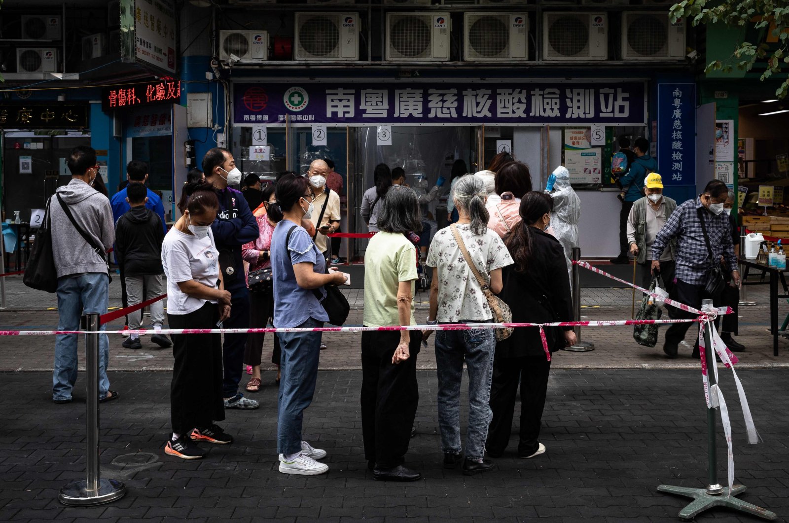 Residents wait in line during COVID-19 tests of the entire population in Macau, China, Nov. 1, 2022. (AFP Photo)