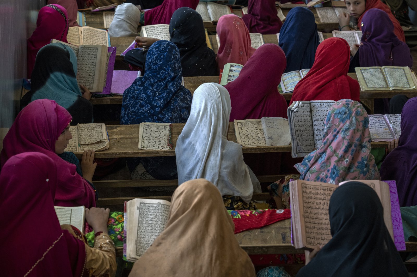 Afghan girls read the Quran in the Noor Mosque outside the city of Kabul, Afghanistan, Aug. 3, 2022. (AP Photo)