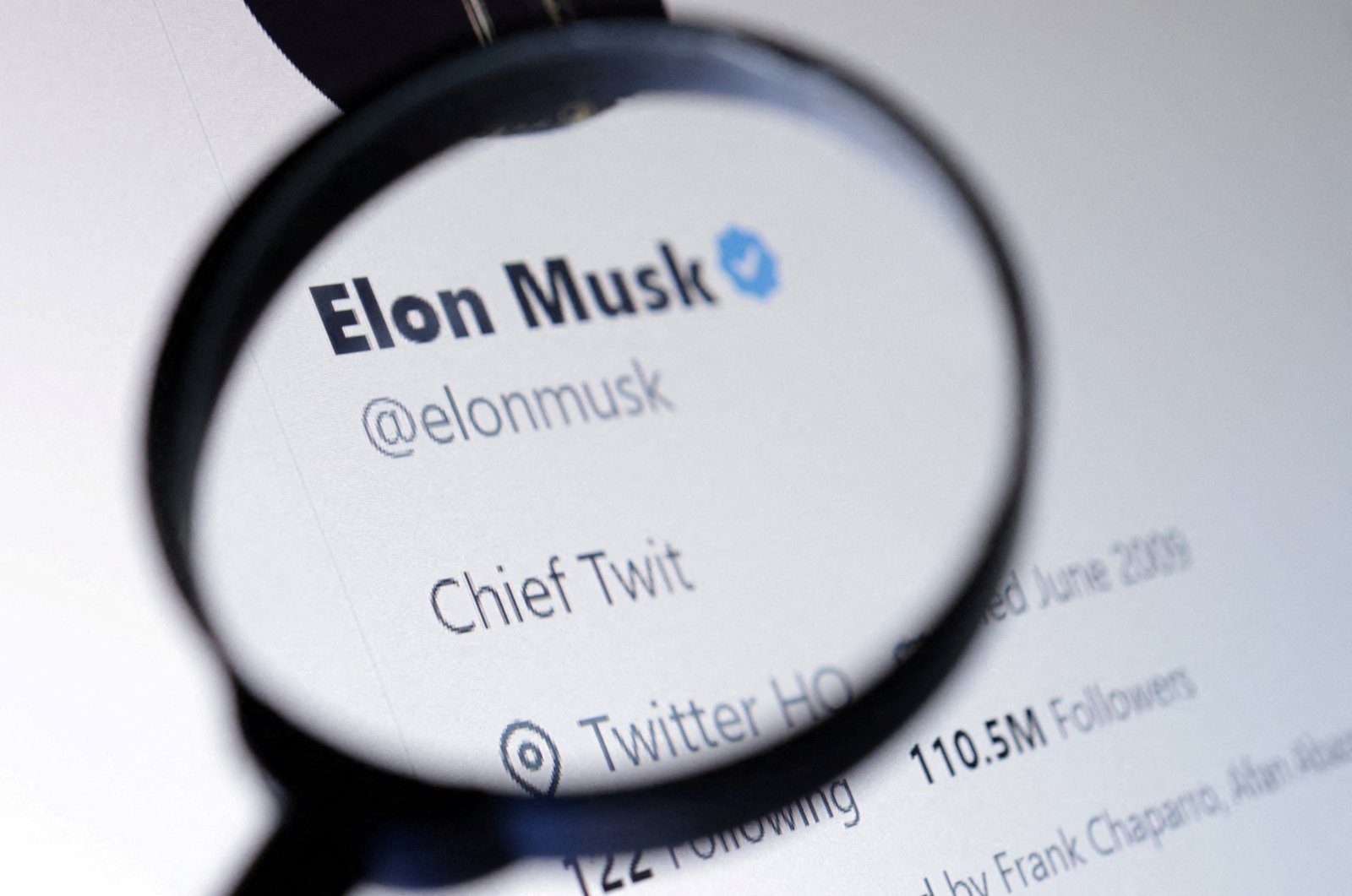 Elon Musk&#039;s Twitter account is seen through a magnifier in this illustration taken Oct. 28, 2022. (Reuters Photo)