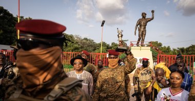 Burkina Faso's President Captain Ibrahim Traore poses with the torch given by revolutionary elders during the ceremony for the 35th anniversary of the Thomas Sankara assassination, in Ouagadougou, Burkina Faso, Oct. 15, 2022. (AFP Photo)