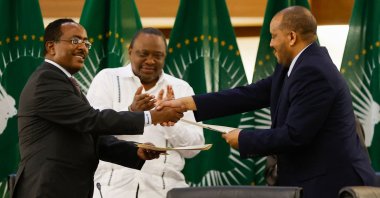 Ethiopian government representative Redwan Hussein (L) and Getachew Reda (R), the representative of the Tigray People&#039;s Liberation Front (TPLF), shake hands after signing a peace deal, Pretoria, South Africa, Nov. 2, 2022. (AFP Photo)