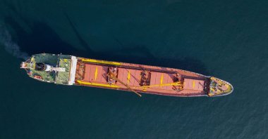 The Joint Coordination Centre officials board cargo ship Mehmet Bey as she waits to pass the Bosporus strait off the shores of Yenikapı during a misty morning in Istanbul, Türkiye, Oct. 31, 2022. (Reuters File Photo)