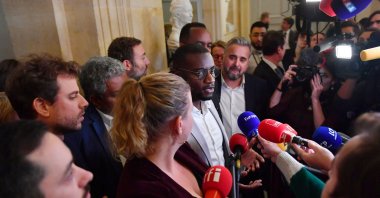 Carlos Martens Bilongo of the leftist France Unbowed party (LFI) speaks to journalists following the exit of questions to the government session at the National Assembly in Paris, France, Nov. 3, 2022. (Reuters Photo)