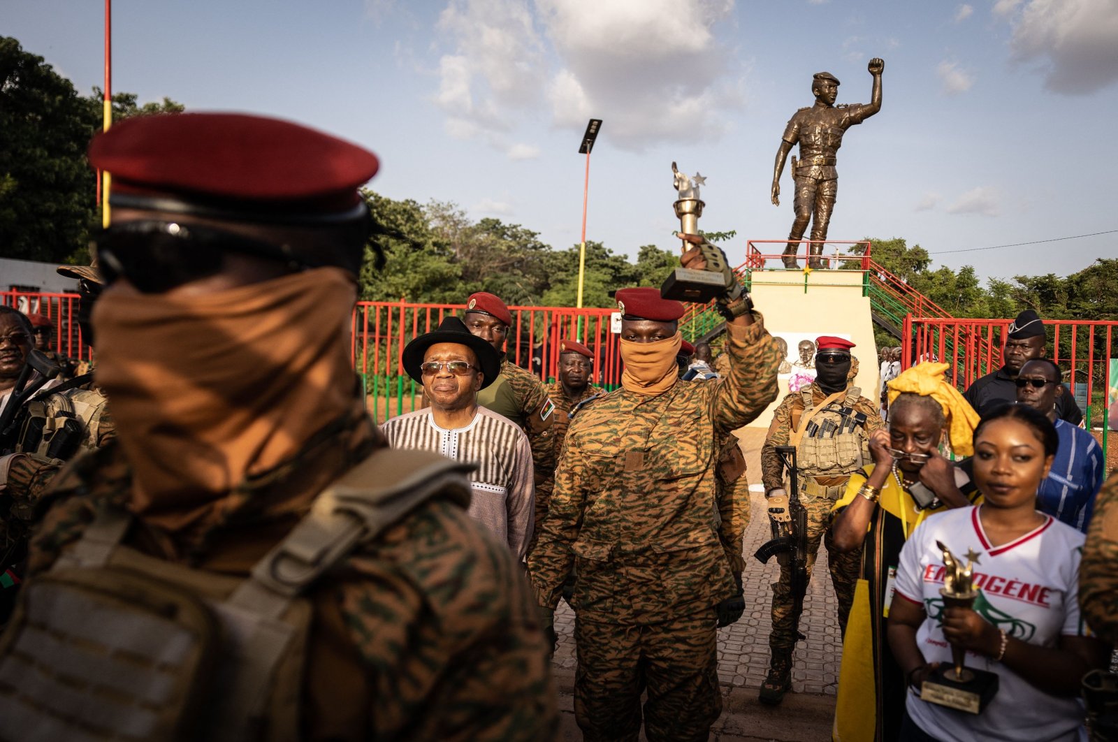 Burkina Faso&#039;s President Captain Ibrahim Traore poses with the torch given by revolutionary elders during the ceremony for the 35th anniversary of the Thomas Sankara assassination, in Ouagadougou, Burkina Faso, Oct. 15, 2022. (AFP Photo)