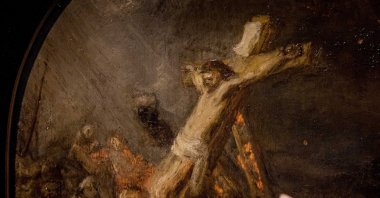 A person points at the painting &quot;The Creation of Jesus on the Cross&quot; by the 17th-century Dutch painter Rembrandt on display at the Museum Bredius in The Hague, the Netherlands, Nov. 3, 2022. (EPA Photo)