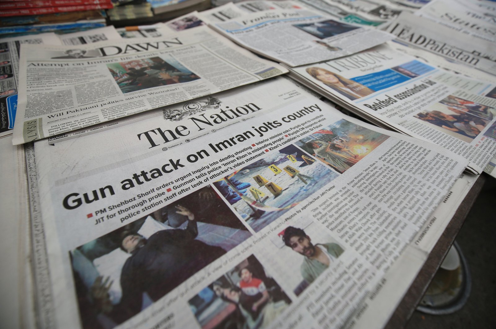 Newspapers reporting the shooting of former Prime Minister Imran Khan at a news stand in Peshawar, Pakistan, Nov. 4, 2022. (EPA Photo)
