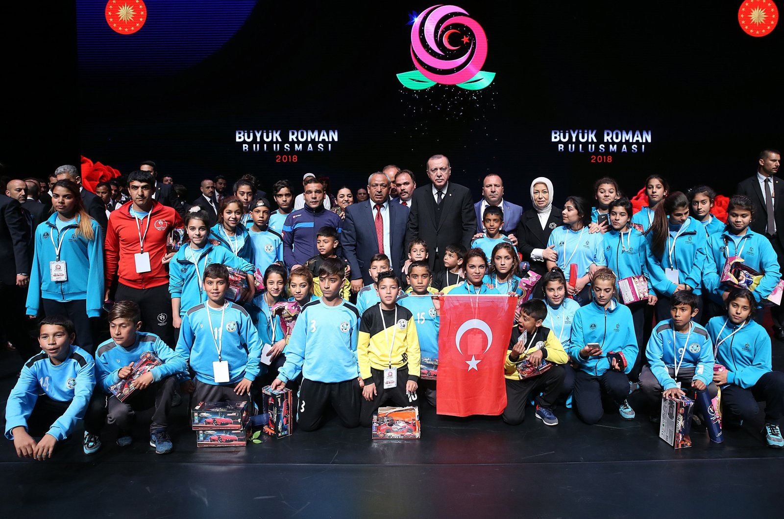 President Recep Tayyip Erdoğan poses with Romani citizens at a convention at the Presidential Complex, in the capital Ankara, Türkiye, April 12, 2018. (İHA Photo)