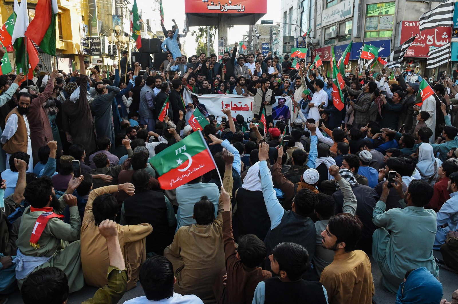 Supporters of former Pakistani prime minister Imran Khan, take part in a protest as they block the main road a day after the assassination attempt on Khan, in Quetta on November 4, 2022. (AFP Photo)