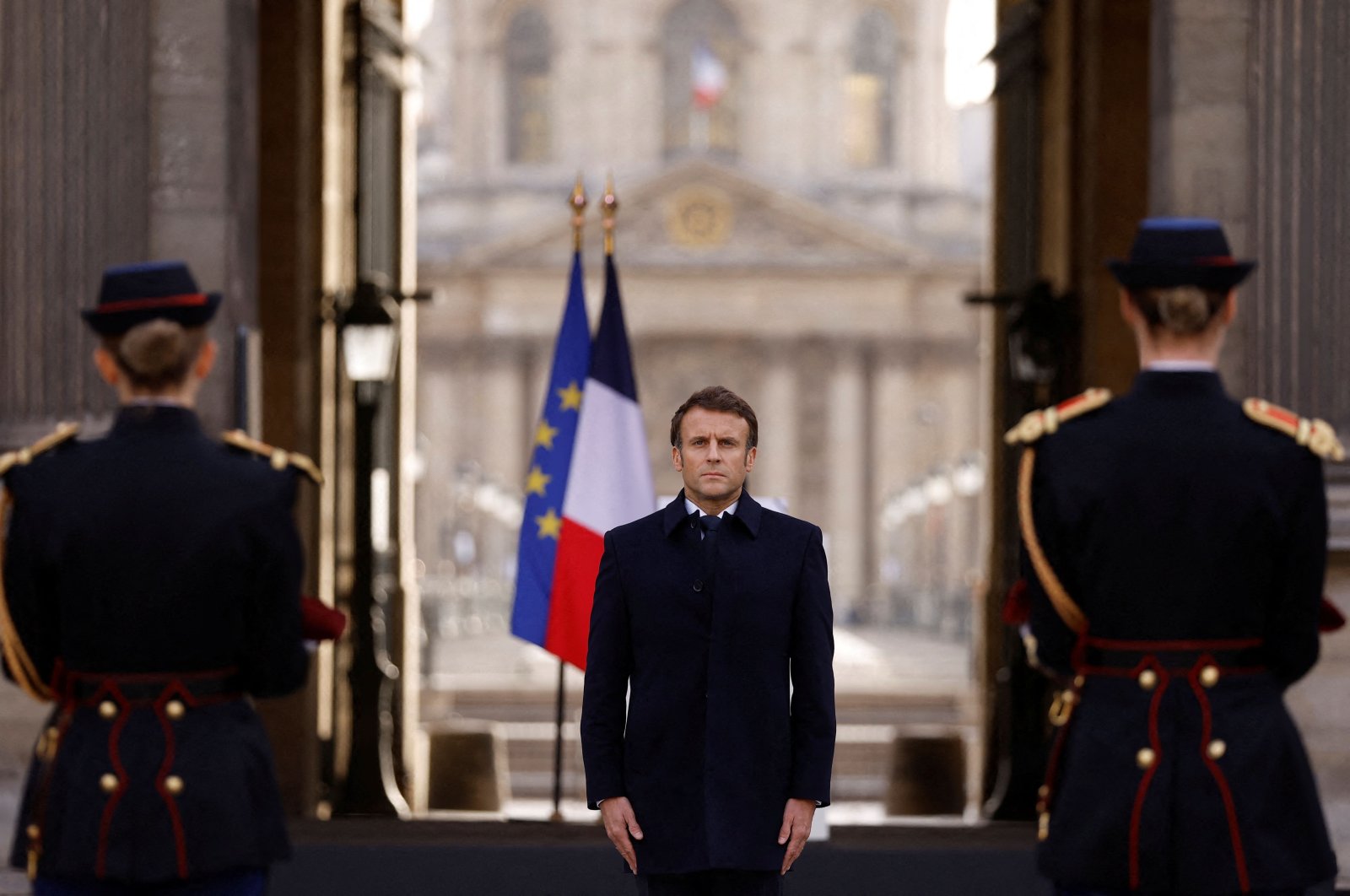 French President Emmanuel Macron stands in front of the coffin of late French abstract painter Pierre Soulages during a tribute ceremony at the Cour Carrée of the Louvre museum in Paris, France, Nov. 2, 2022. (AFP Photo)