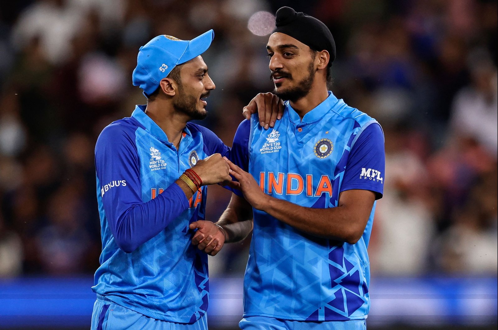 India&#039;s Axar Patel (L) and Arshdeep Singh celebrate their win over Zimbabwe in the Twenty20 World Cup, Melbourne, Australia, Nov. 6, 2022. (AFP Photo)