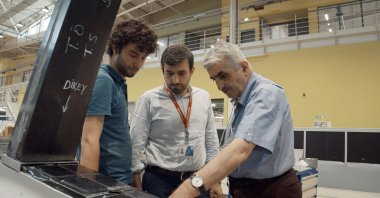 Özdemir Bayraktar (R) with his son Selçuk Bayraktar (C), the chief technology officer of Baykar, is seen in this undated file photo. (Courtesy of Baykar)