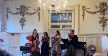 (L-R) Cellist Dilbağ Tokay, pianist Emine Serdaroğlu, mezzo-soprano Eylül Elif Arslan and Andante Editor-in-Chief Serhan Bali at the end of the concert, Istanbul, Türkiye, Oct. 6, 2022. (Photo by Derya Taşbaşı)