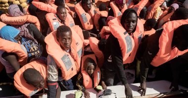 Migrants prepare to get on board the Ocean Viking ship sailing in the international waters off Libya in the Mediterranean Sea, Oct. 25, 2022. (AFP Photo)