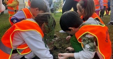 Children plant a sapling at an event in Zonguldak, northern Türkiye, Nov. 8, 2022. (İHA Photo)